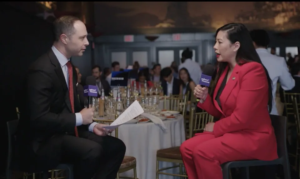 Caroline Pham speaking at the Coinbase Annual Summit.